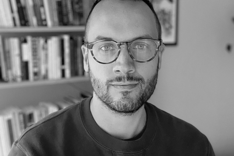 Black and white photo of Tom McQuaid