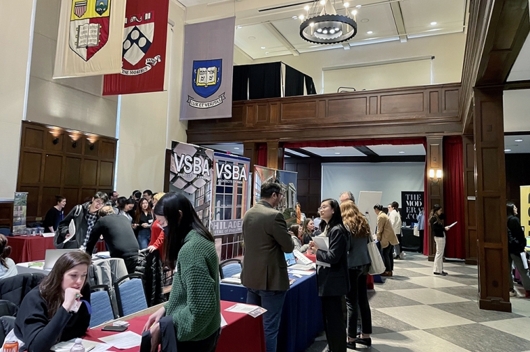 Students talking with employers in Houston Hall for the Career Fair.