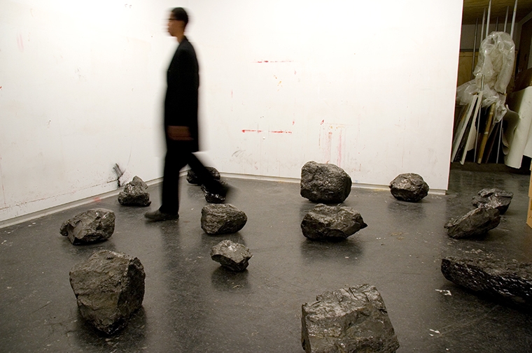 Still of artist Demetrius Oliver moving through art installation.