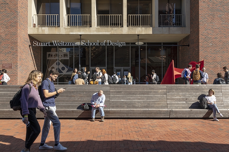 Students outside of the main entrance of Meyerson Hall.