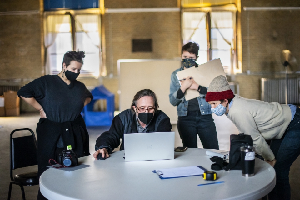 students and instructor on computer