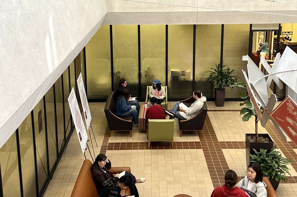Students speaking in the lobby of the McNeil building