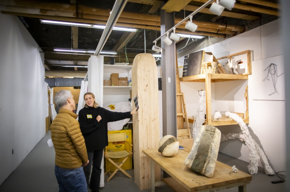 Photograph of Victoria Megens (MFA'24) showing Michael Grant her studio