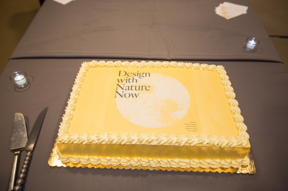 Cake with "Design With Nature Now" logo on it