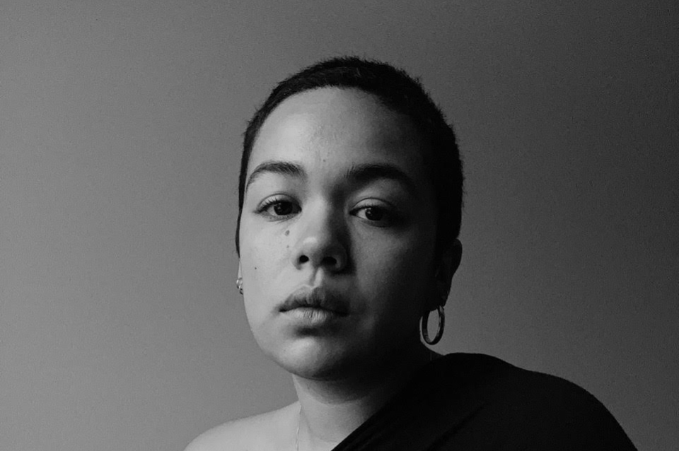Black and white photo portrait of Nancy Valladares wearing black shirt