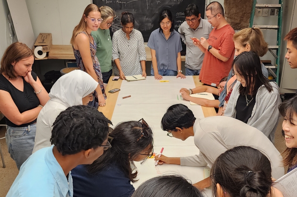 students around table doing group activity