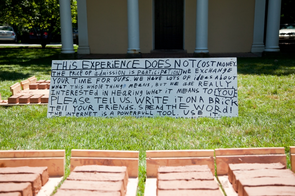 hand-written sign on grass