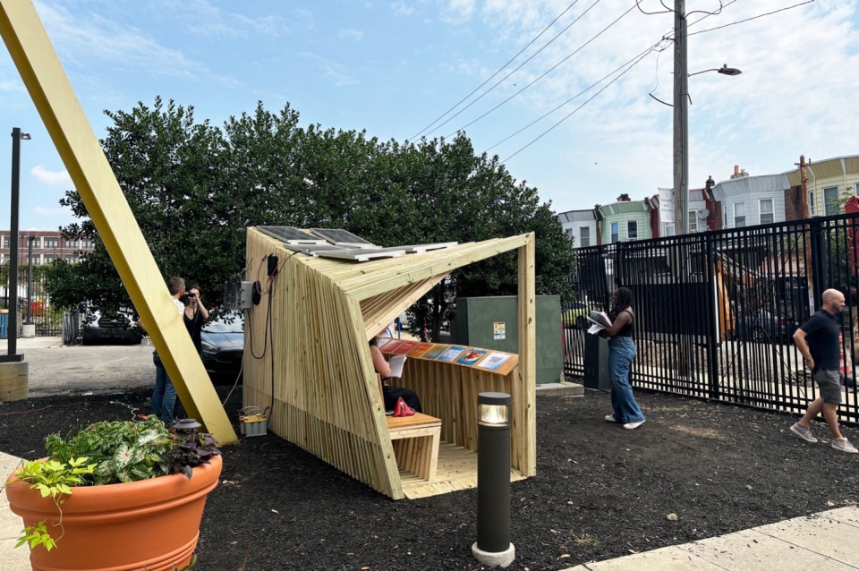 Wooden pavilion with books inside on a sunny day
