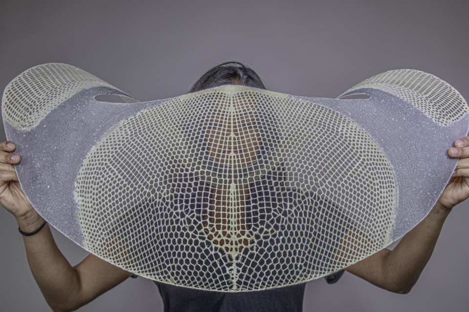 Woman holds up lattice