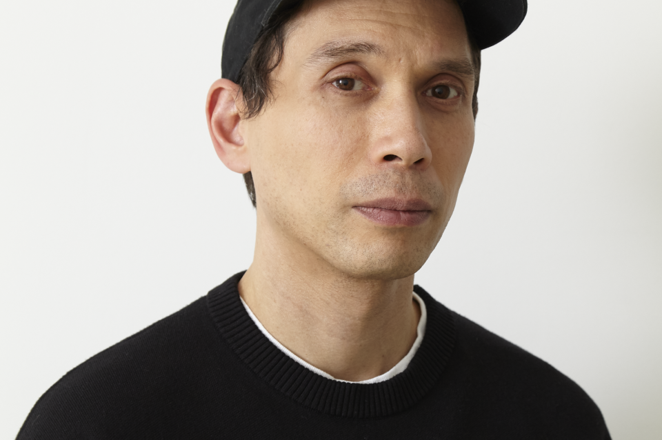 Photograph portrait of Josh Kline from the shoulders up in front of a white background