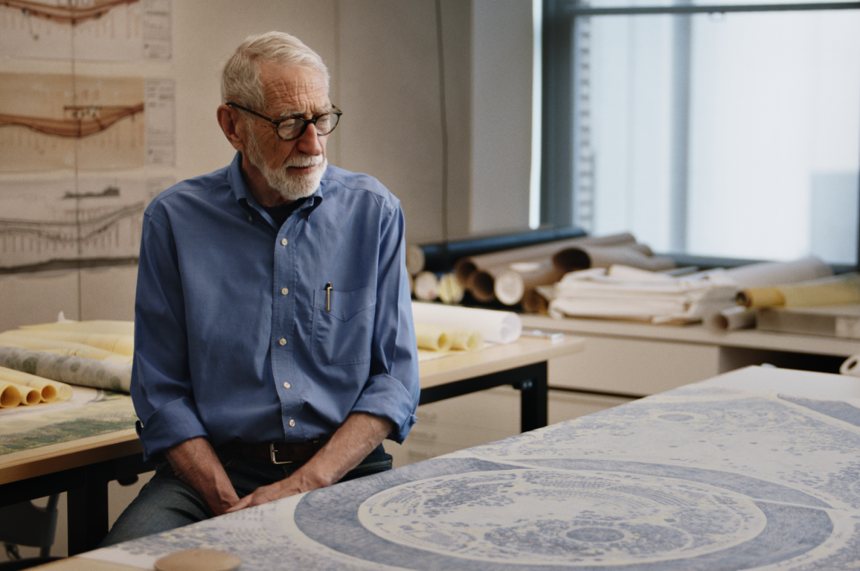 Laurie Olin in his studio seated in front of drawing