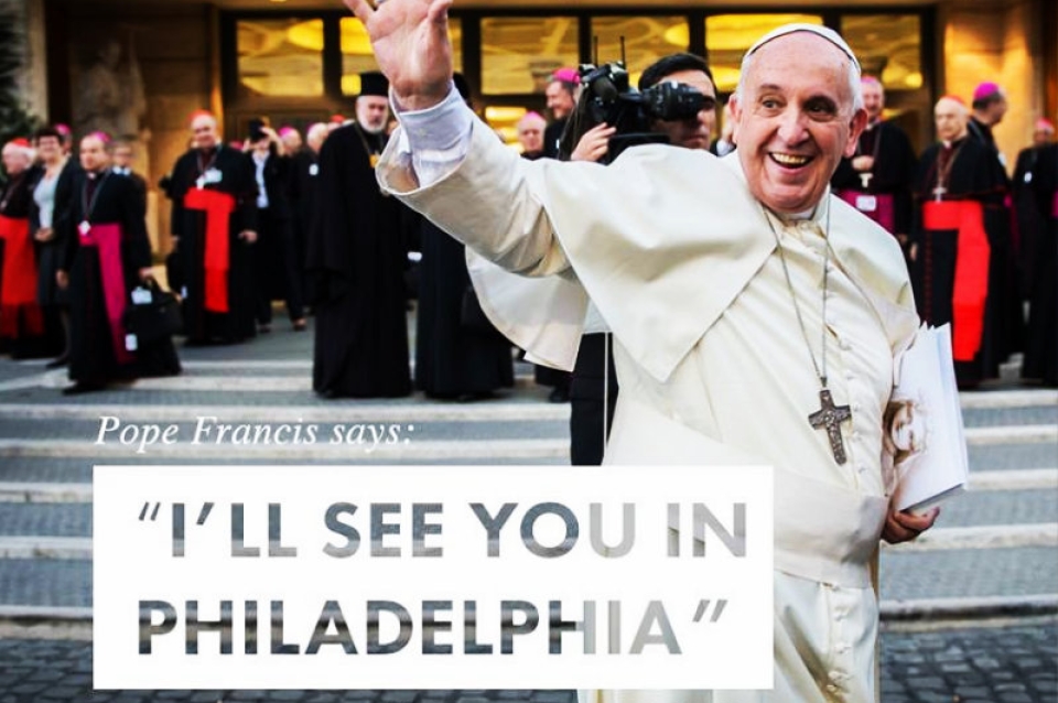 Sign for Pope's visit to Philadelphia saying "Ill see you in Philadelphia" picture of the Pope waving as the background