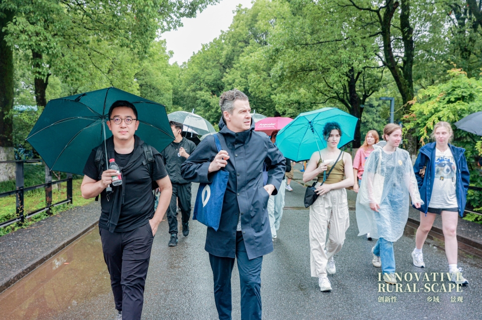 People walk in urban park with umbrellas