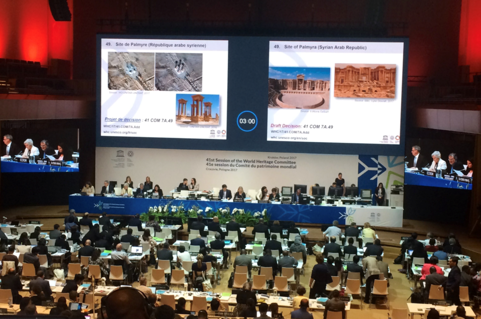 View of stage with projected images at international conference