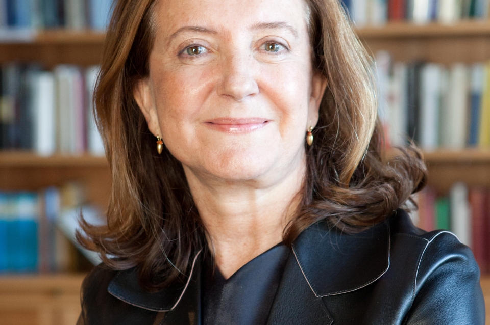 Headshot of Beatriz Colomina with bookshelf in background