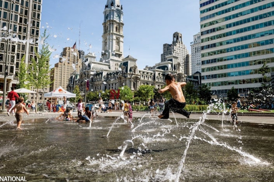 City hall with children playing in fountains in front