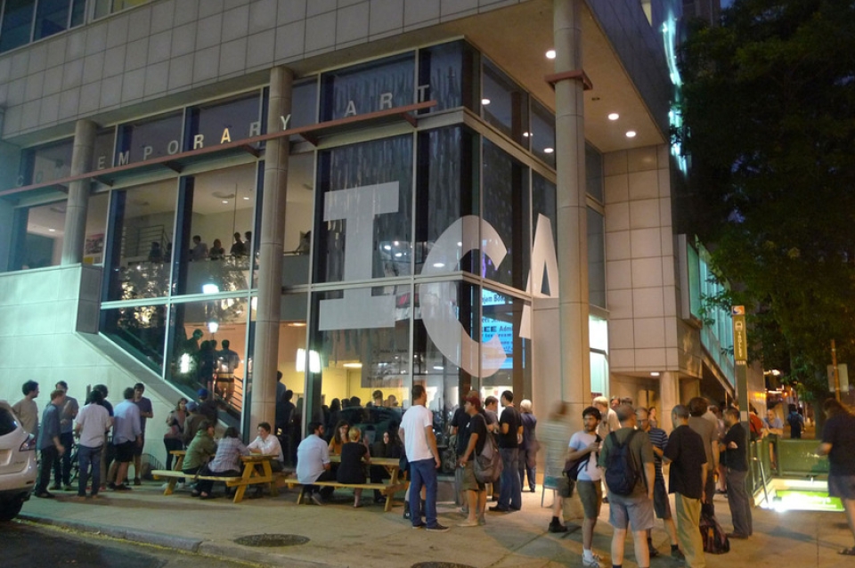 Large group gather outside ICA