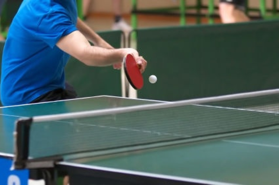 Man hitting a pingpong ball
