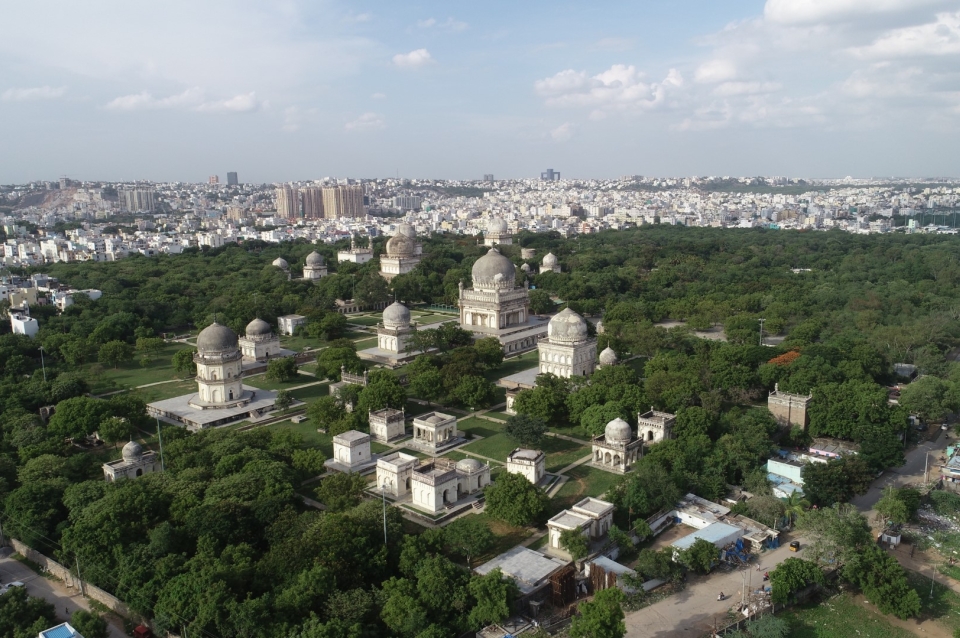 Landscape photograph of park in foreground and urban space in background