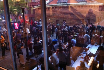 Gathering of people outside Fisher Fine Arts Library