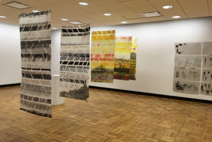 Prints hanging in a gallery