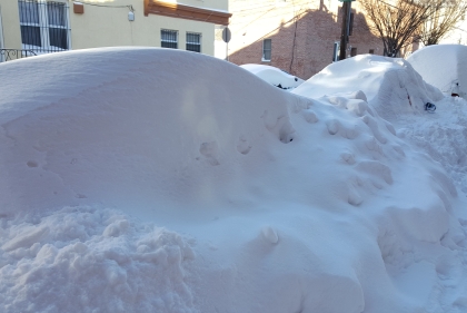 Snow banks on sidewalk