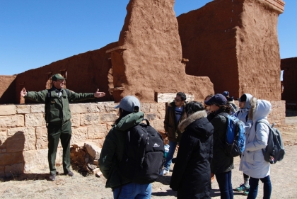Students listen to an interpretive presentation by park staff in order to better understand the site’s complex history.