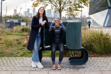 Alum Portia Malik poses next to her winning bench design