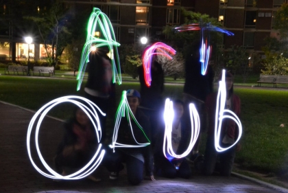 "Art Club" written in moving light