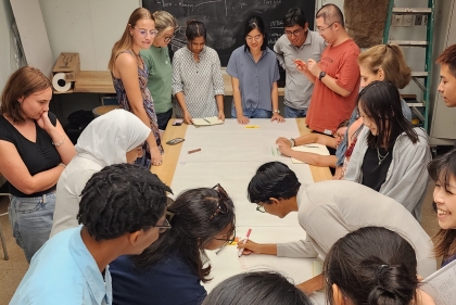 students around table doing group activity