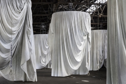 Many cylindrical curtains in large showing space