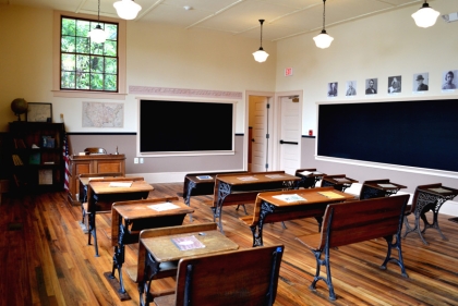 Empty classroom with old wooden desks