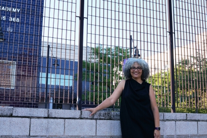 Alumna Amneris Rasuk outside the Bronx public school where she teaches