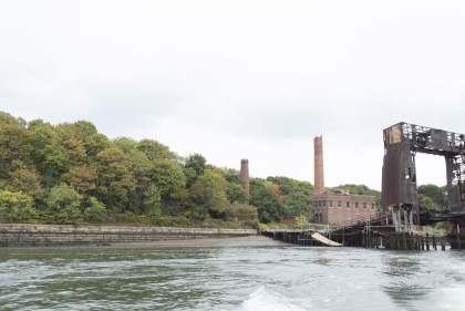 The gantry and beach provided an access point to North Brother Island. The smokestacks are the most visible built fabric from the Bronx shore. Photo by Andrea Haley.