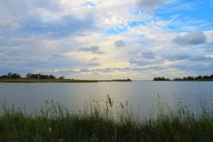 View of sunrise/sunset over bay from short