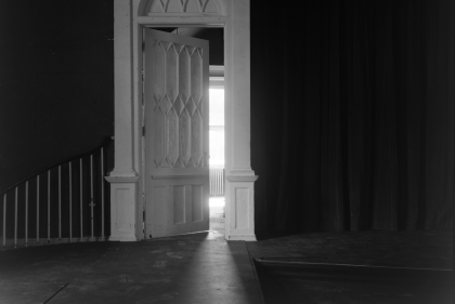 Black and white photo of neo-Gothic 19th-century interior doorway