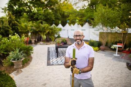 Alum and lecturer, Abdallah Tabet, standing in his exhibit at the Philadelphia Flower Show.
