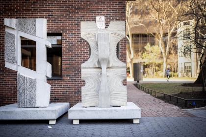 Geometric concrete totems on concrete plinths