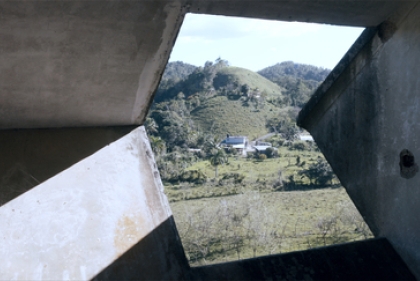 View out doorway on to field from 'in the forest'