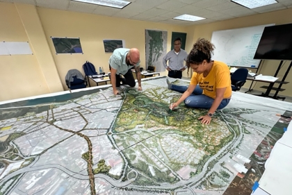 Group of people on landscape drawing on a table