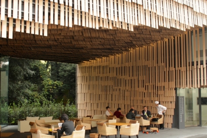 Seating area under stylish wood plank archway
