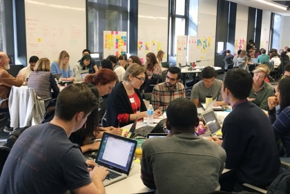 Groups of students talking at IDI 24-Hour Challenge