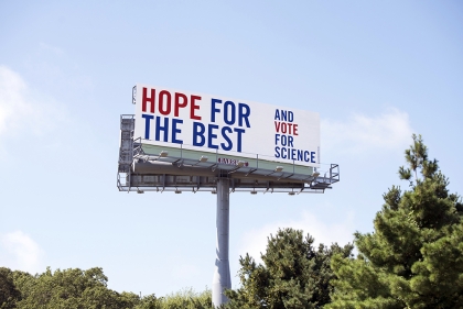 Billboard saying "Hope for the best and vote for science!"