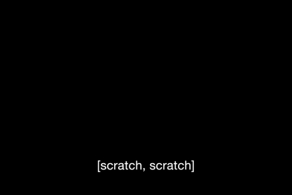 A pitch black background. Centered in the bottom third of the image are white captions that read, "[scratch, scratch]".