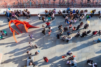 Patio of Penn Design building with a crowd and the Calder piece