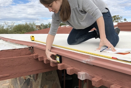 Mia Maloney conducts an assessment on the wooden features of the Original Dining Room at Taliesin West in January of 2019. In order to understand the degree of deterioration of the four projecting beams, moisture content readings are recorded and mapped on elevation drawings.