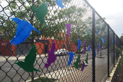 Bird designs on chain link fence at William Cramp Elementary School