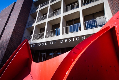 Close up of Calder sculpture with school of design building in the background