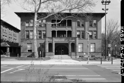 Black and white photo of 3-story Italianate facade