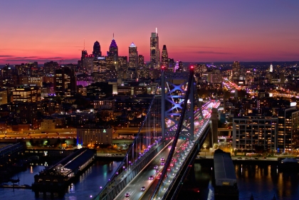 Philadelphia skyline against violet sky at dusk